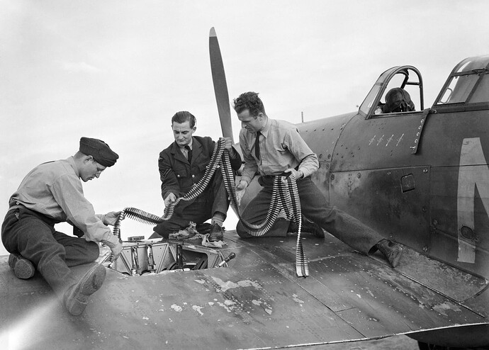Armourers_replenish_the_ammunition_in_a_Hawker_Hurricane_Mk_I_of_No.310(Czechoslovak)_Squadron_RAF_at_Duxford,_Cambridgeshire,