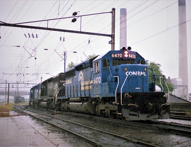 CR. SD40-2 #6470, SD40 #6302 & other in Harrisburg, PA station on a rainy Sept 15, 1979
