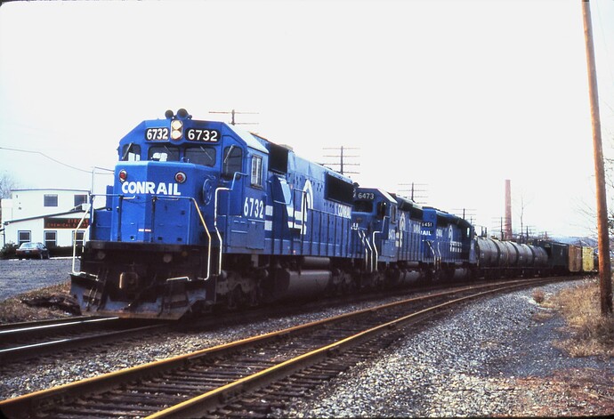 Photo 109. PIOI led by SD50 #6732. 12-14-85. Prospect Ave, note rusty rail out of service.