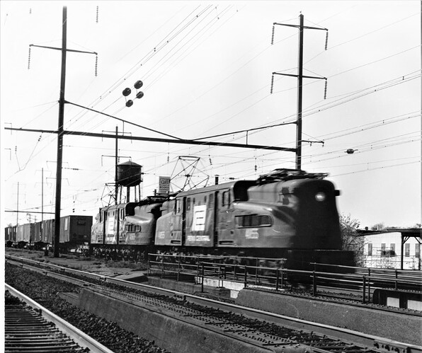 PC # 4855 & #4869 eastbound Fast Mail #10, Flexi-van train at N. Rahway, Sept 17,  1972