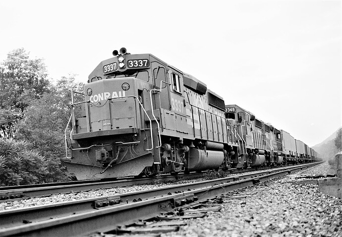Conrail GP40-2 #3337 & #3348 (blt 6-1978) west bound trailer train at Cove, PA. August 17, 1978