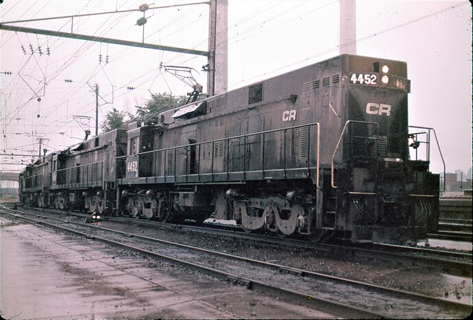 Conrail. E-44 #4452, #4400, #4432 & #4422 on heavy grain train. Harrisburg, PA. Sep 1979