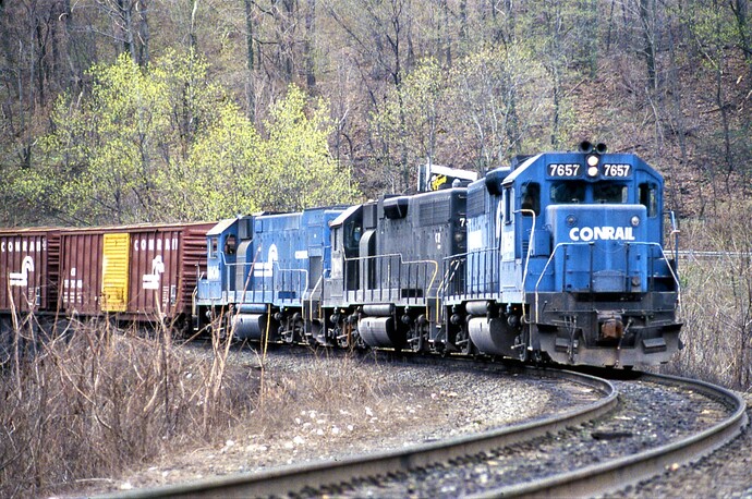CR. GP-38AC (ex LV)  #7657, ex PC GP-38 #7840, GP-15 #1606 on Rockville Bridge approach. 4-28-84