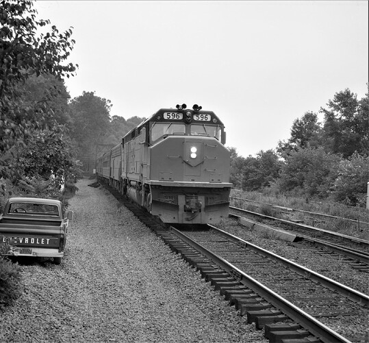 Penn Central-Amtrak National Limited. Amtrak #596. SDP-40F  East bound at Banks Tower near Marysville, PA. Aug. 17, 1975