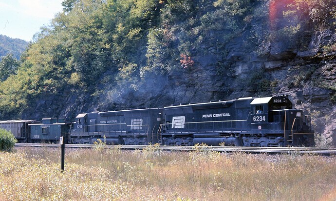 PC.  SD-45 #6215 &  #6234 pushing freight at Horseshoe Curve Oct 13, 1974