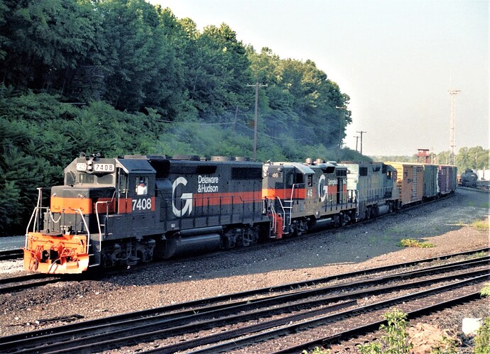 Guilford GP38-2 (ex-D&H, RDG 3408,12-78) #7408, Springfield Terminal GP-9 #46 & a GP39-2. Allentown, PA yards. August 25, 1980.