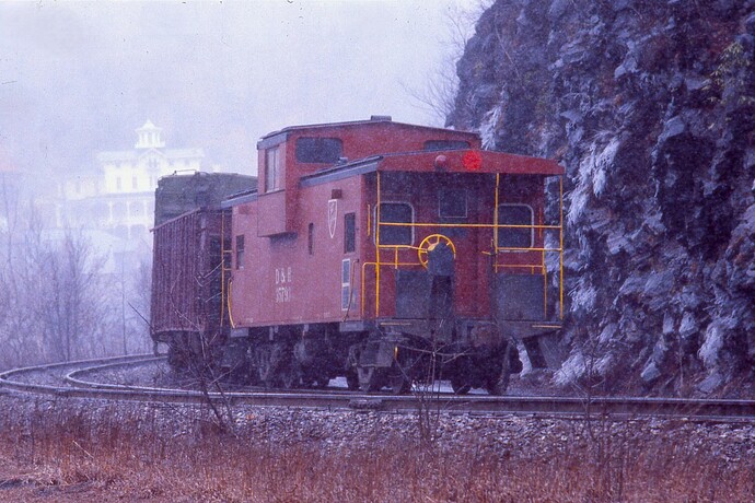 D&H. Caboose #35791 on rear of northbound freight. Town of Jim Thorpe in background. Mar 1980
