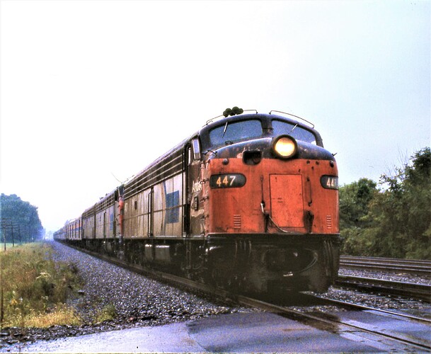 Amtrak. E-8 #447 & 2 other units. Eastbound Tr 40, Broadway Limited. Cove, PA. Sept 15, 1979