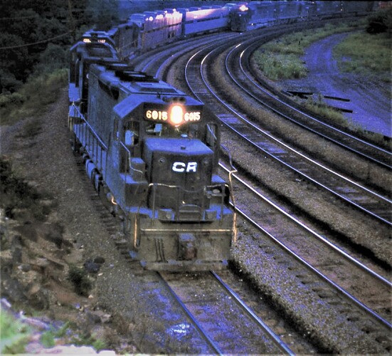 Ex PC SD-35 (PRR) #6015 with westbound freight at Benny evening of Aug 16, 1977. S N 30403, Ordr No 7795. Blt 3-1965