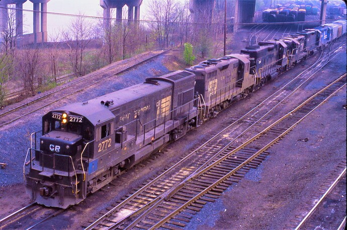 Conrail. GE U23B #2772 & 5 more diesels at Enola yards in PA. 1979