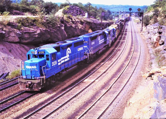 CR. GP40 #3135, SD45-2 #6670 & GE with freight towards Altoona, PA. Benny Curve, PA  Sept 15, 1977