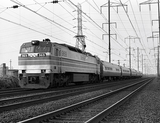 Amtrak. E-60 #969 west on track 3, signal #347. New Brunswick, NJ. August 1975