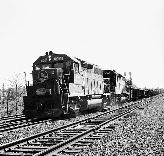 CNJ. B&O GP-35 # 4001 and CNJ SD-35 # 2501 on west bound freight at RK Tower. 1973