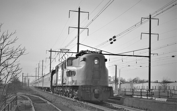 PC. GG-1 #4866 with NY&LB train east at North Rahway, NJ. Oct 1973