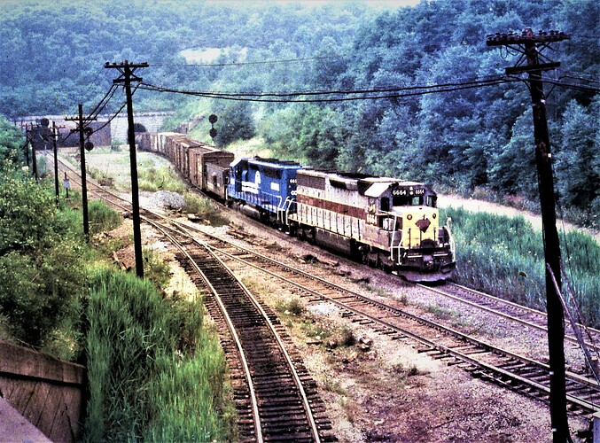 CR. ex E-L SD-40 #6664 & ex EL SD-45 pushing freight at Gallitzin Tunnels in July 15, 1978