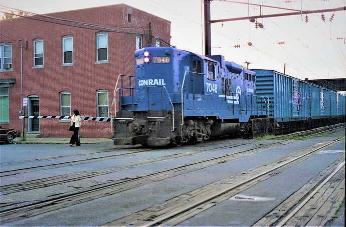 Conrail freight & GP-9 #7048 (ex PRR) at South Amboy, NJ. Train is going to old Raritan River Railroad trackage. Aug, 21, 1980