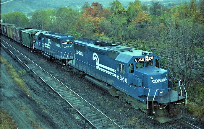 Conrail. SD40-2 #6366,(blt 6-77) #6448 (blt 9-78)  at Enola, PA. evening Sept 1980