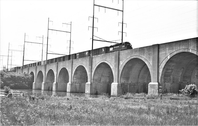 Penn Central GP-30 #2248 with eastbound freight.  shot from Highland Park, NJ side ot Raritan River. June 1975