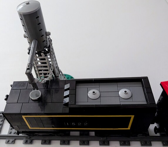 very small railroad water tower - refueling locomotive