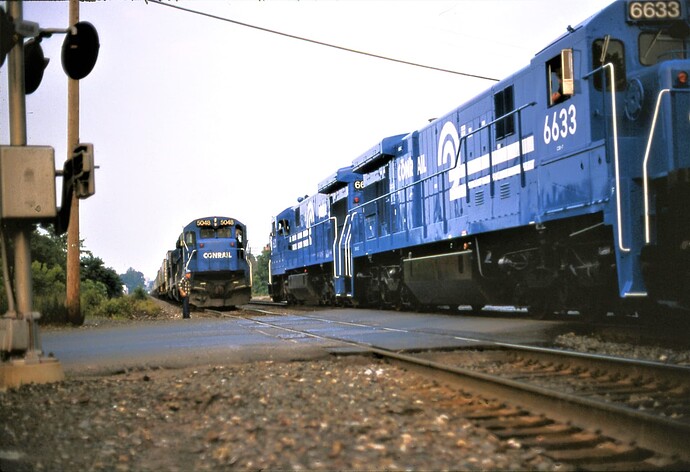 Conrail. Meet with B36-7 #5048 & C30-7 #6637,6633 & 3rd unit. Front St, So. Plfd 1986