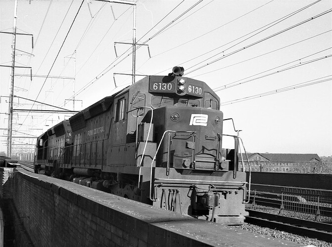 Penn Central SD-45 #6130 & another SD-45. Westbound in New Brunswick, NJ. June 1974