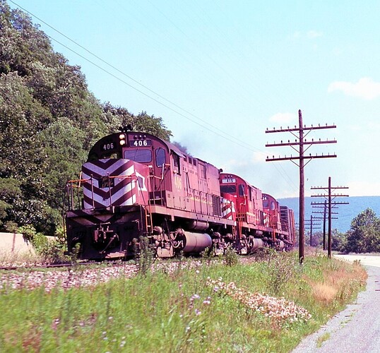 Alco's #406, #415 & #404 on P&E along side Rt 322. July 15, 1976