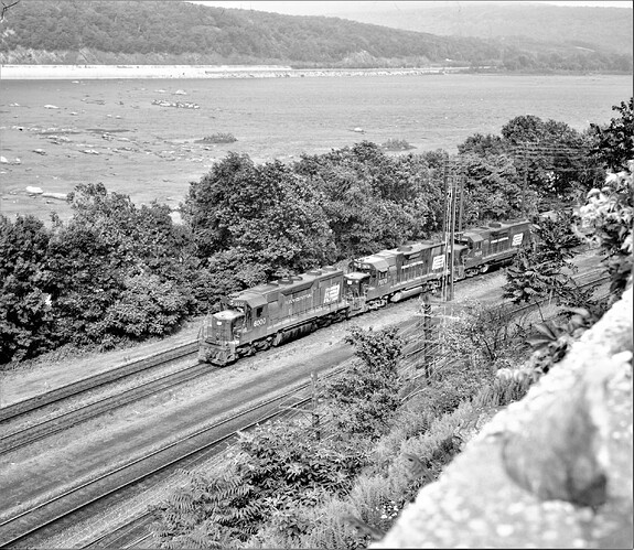 Penn Central SD-35 # 6000, GP-40 #7970 GP-40 # 3068. Banks Tower near Marysville, PA. June 1974