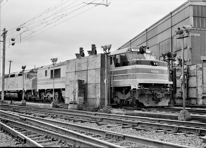 Amtrak P-30 #703 at McClay Street in Harrisburg, PA.  Engine getting washed! June 1975