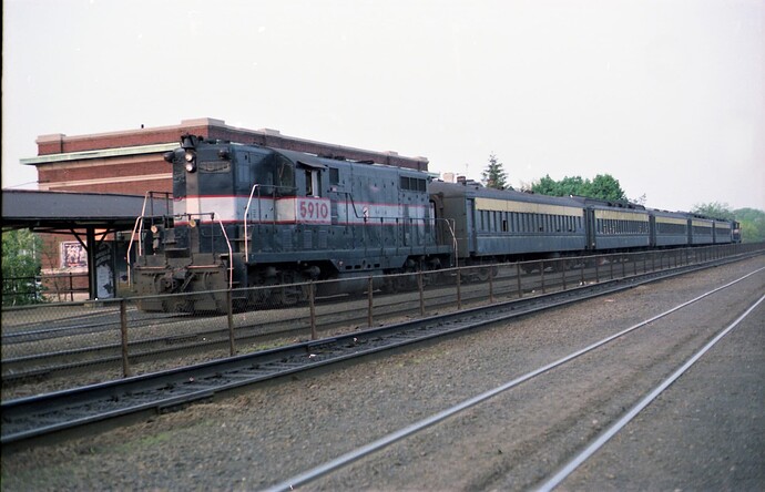 NJT GPFP-37 # 5910 west bound push-pull passenger with FPSD #5902 on the rear at Bound Brook, NJ .Sept 1981
