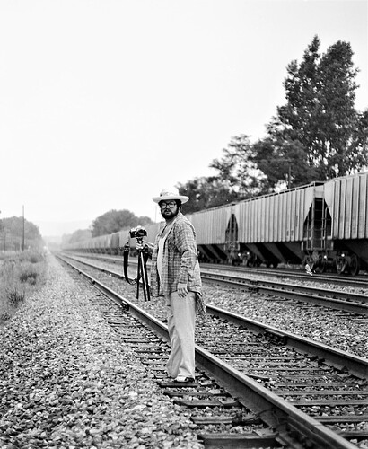 Conrail. Snuffy taking pictures at Cove, PA. August 1977.