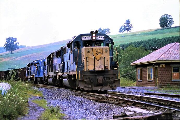D&H GP38-2 #7323 leading freight at SW Tower, Ninevah, NY in August 1984
