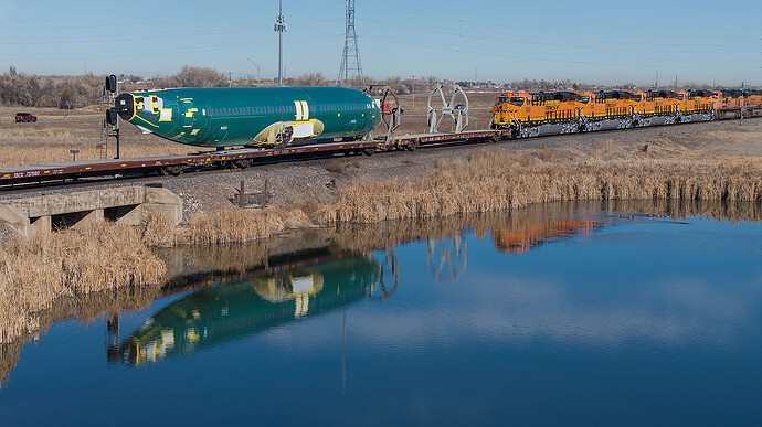 20251215rp BNSF 3363 ES44C4 Boeing fuselage Alliance TX to Portland OR water reflection Lochbuie CO_0035_D copy