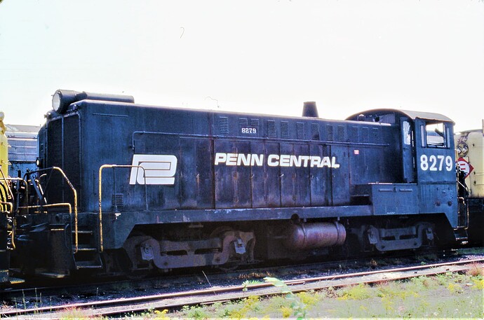 Conrail. ex Penn Central Baldwin #8279 on Altoona, PA scrap line. August 17, 1977