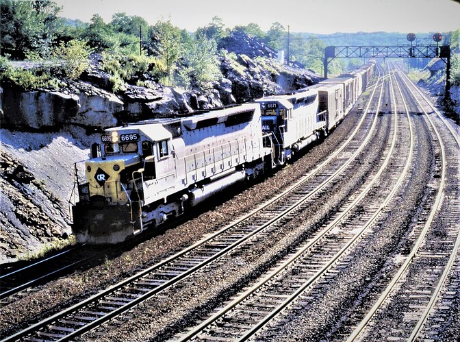 Conrail. SD45-2 #6695 & #6671. Both are ex E-L units. Benny Interlocking in PA. afternoon of July 17, 1977