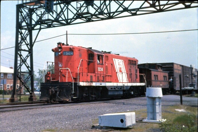 CNJ. FPSD-37 #1524,Red Baron paint, westbound, High Bridge local  Raritan, NJ August 1973.