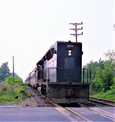 NJT GP-40P # 4104 south bound at Cliffwood Avenue crossing ciffwood Beach, NJ. Sept 1983