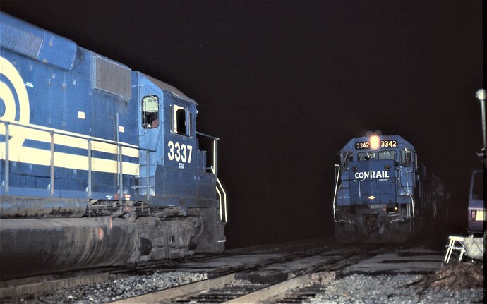 GP40-2 #3337 meets GP40-2 #3342 at nite at Prospect Ave, Piscataway, NJ. September 1982