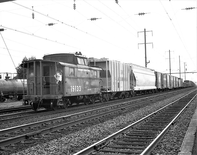 Penn Central.  East bound & N5 caboose #19133 on Track 2 at North Rahway, NJ. Sept 17, 1972