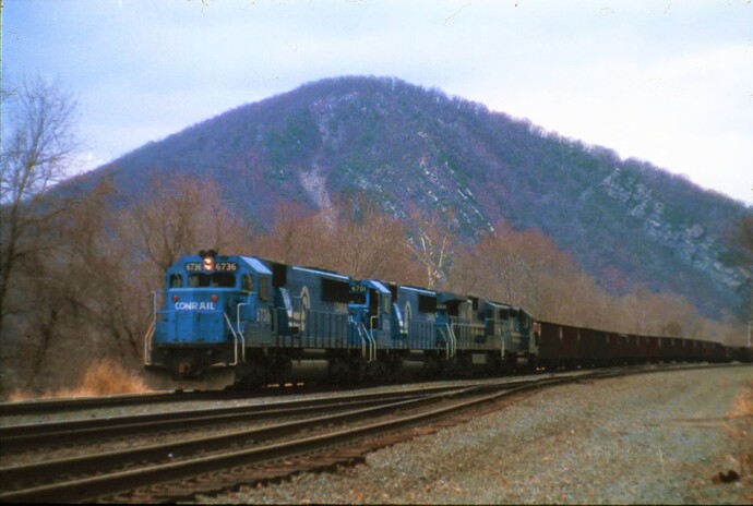 Conrail SD-50 #6736 with PPL unit train on Middle Division near Banks Tower. Peters Mountain in background.  Sept 1981
