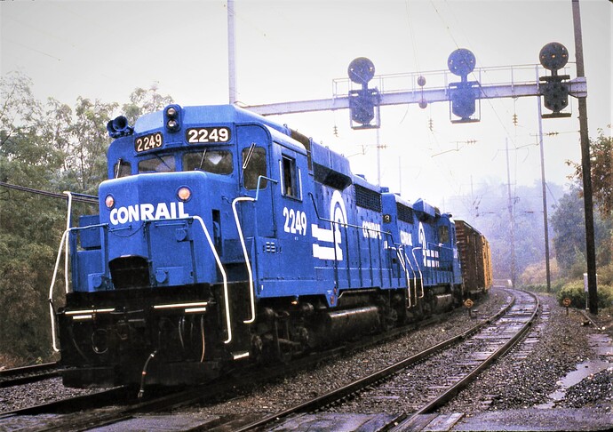 CR. GP30 #2249 & other GP30 with freight on a rainy day at West Fairview, PA. Sept 15, 1979