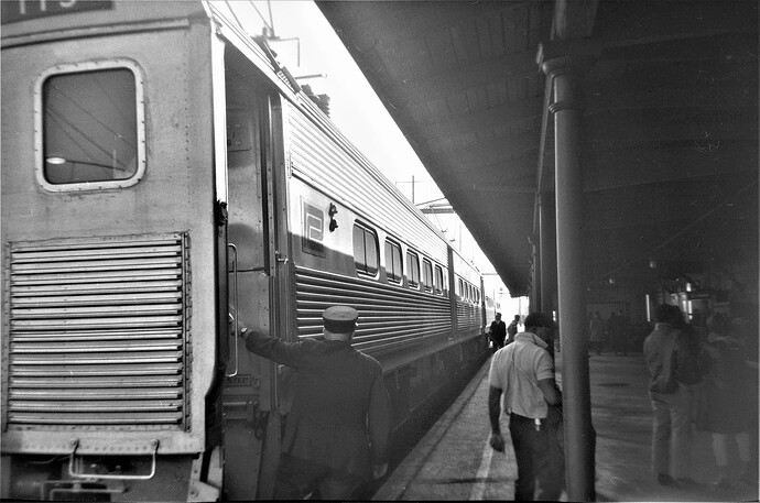 Penn Central. 'All Aboard' as the westbound (100 series) commuter train gets ready to leave New Brunswick, NJ in October 1968