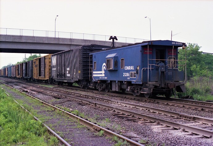 Conrail. Caboose N21 #21286 on westbound freight at So. Plainfield, NJ. Aug 1982