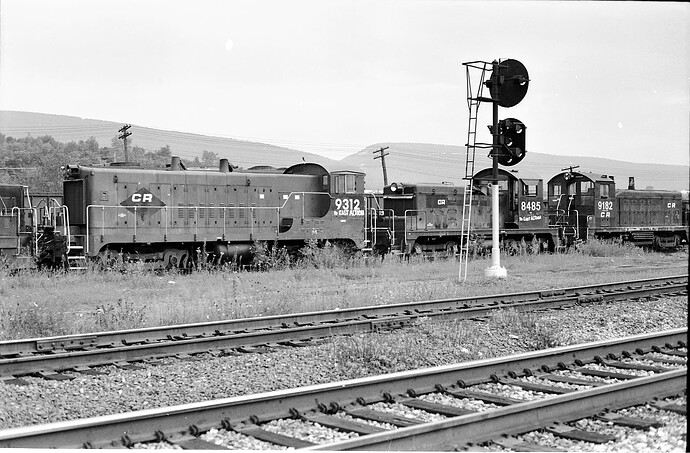 Conrail. Altoona scrap yard. BLW VO-1000M #9312; SW-1 #8485; NW2 #9182  8-16-78