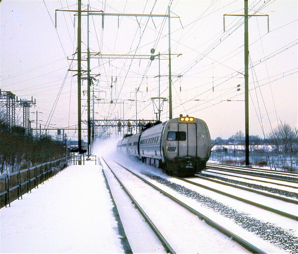 Amtrak. Metroliner #803, still with PC marking. west on trk 3 at Jersey Ave. Feb 1976