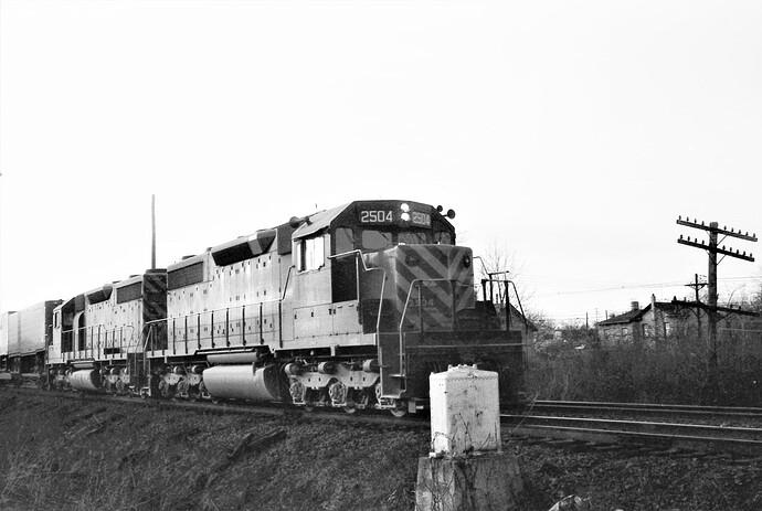 CNJ. SD-35 #2504  & #2503 with westbound freight at M.P. 38 near Raritan, NJ. March 1974