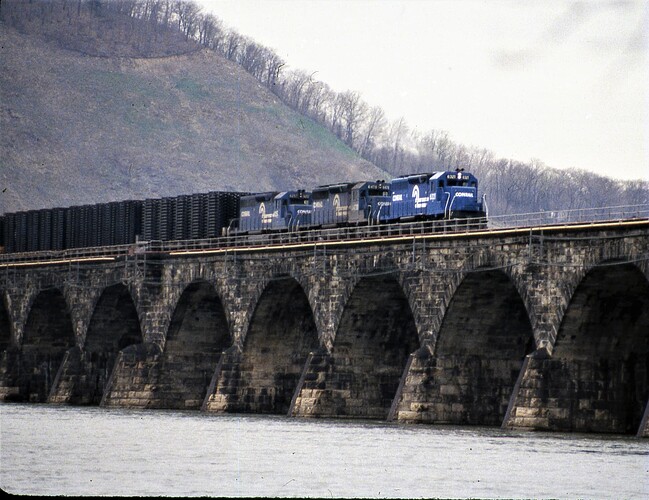 CR. SD-40 #6321, SD40-2 #6478, SD-40 #6257 with westbound train of auto frames on Rockville Bridge. Mar 12, 1984