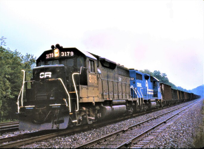 CR. GP40 #3179 & GP38 #7832 with westbound PP&L coal train early morn rain. Cove, PA. Sept 15, 1979
