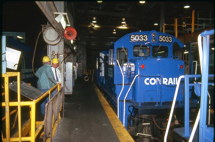 Conrail. Enola Diesel Terminal with GE B36-7 #5033 being serviced. May 1986