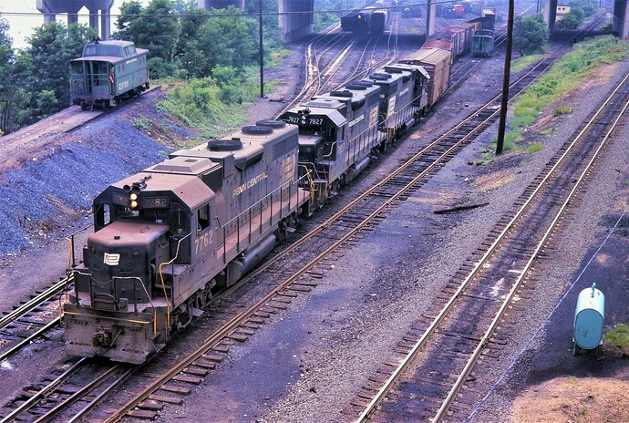 Penn Central GP-38 #7762, #7827. & #7738 are westbound at Enola,in June 1975