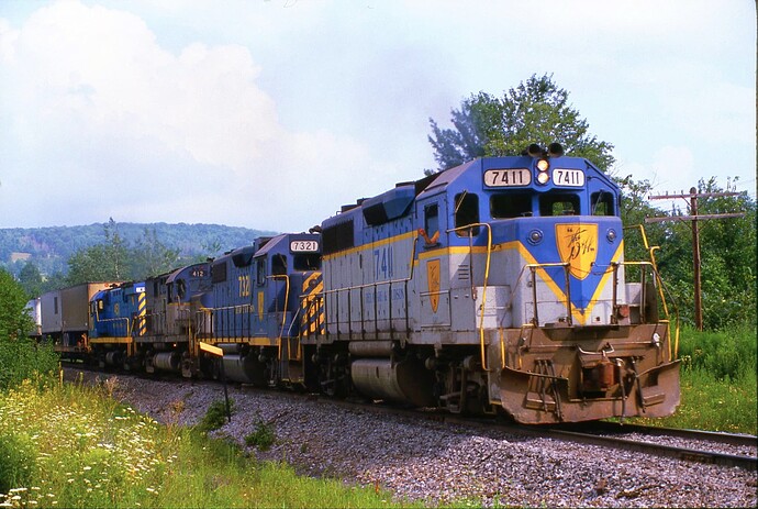 D&H. GP39-2 #7411, GP38-2 #7321, C-420 #412 &  C-424m #451,   Rt 7, Saniteria Springs, NY. August 1984